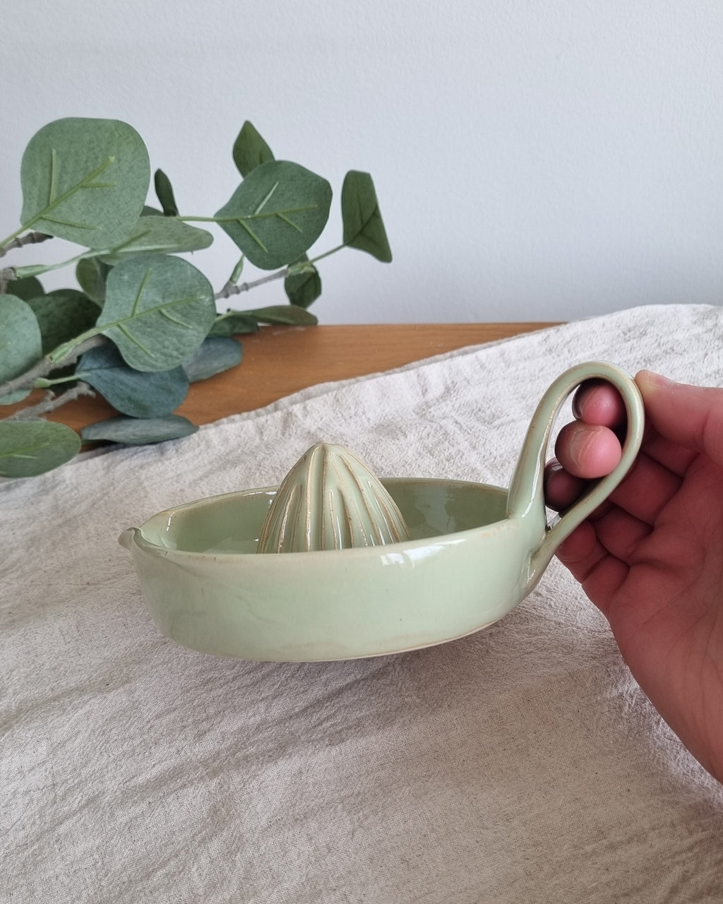 Handmade Ceramic Citrus Juicer with Handle in Pastel Green
